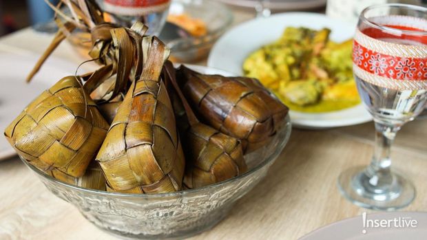 Ketupat Lebaran. Traditional Celebratory Dish of Rice Cake or Ketupat with Various Side Dishes, Popular Served During Eid Celebrations.