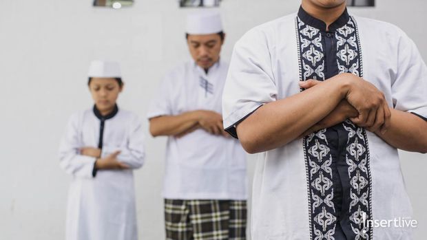 Religious muslim man praying inside the mosque