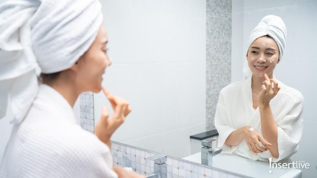 Flat lay composition with skin care products and lemon fruit on white background