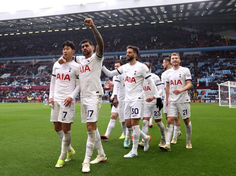 BIRMINGHAM, ENGLAND - MARCH 10: Son Heung-Min of Tottenham Hotspur celebrates scoring his team's third goal with teammate Cristian Romero during the Premier League match between Aston Villa and Tottenham Hotspur at Villa Park on March 10, 2024 in Birmingham, England. (Photo by Alex Pantling/Getty Images)