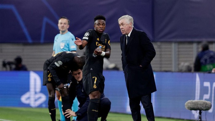 LEIPZIG, GERMANY - FEBRUARY 13: Vinicius Jr of Real Madrid, coach Carlo Ancelotti of Real Madrid  during the UEFA Champions League  match between RB Leipzig v Real Madrid at the Red Bull Arena on February 13, 2024 in Leipzig Germany (Photo by David S. Bustamante/Soccrates/Getty Images)