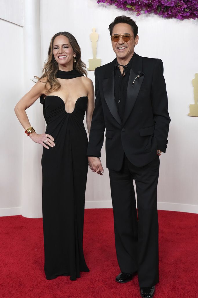Susan Downey, left, and Robert Downey Jr. arrive at the Oscars on Sunday, March 10, 2024, at the Dolby Theatre in Los Angeles. (Photo by Jordan Strauss/Invision/AP)
