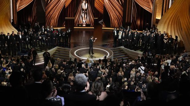 Robert Downey Jr., left, and Emily Blunt appear in the audience during the Oscars on Sunday, March 10, 2024, at the Dolby Theatre in Los Angeles. (AP Photo/Chris Pizzello)