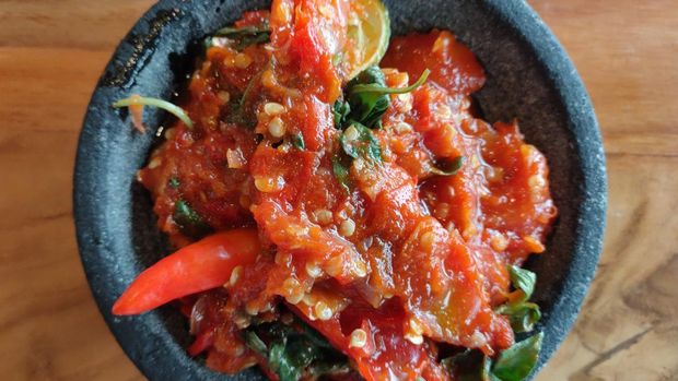 Indonesian hot sambal with red chilies, tomatoes, and many ingredient