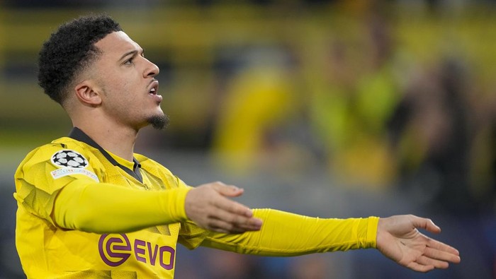 Dortmunds Jadon Sancho celebrates after scoring his sides opening goal during the Champions League round of 16 second leg soccer match between Borussia Dortmund and PSV Eindhoven at the Signal Iduna Park in Dortmund, Germany, Wednesday, March 13, 2024. (AP Photo/Martin Meissner)