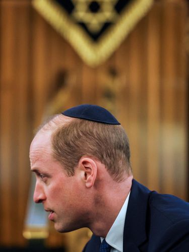 Britain's Prince William, Prince of Wales wears a kippah during a visit to the Western Marble Arch Synagogue, in London, on February 29, 2024. (Photo by Toby Melville / POOL / AFP)