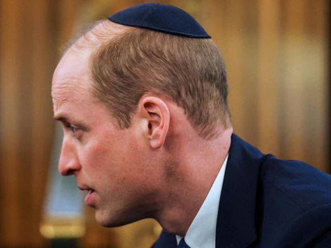 Britain's Prince William, Prince of Wales wears a kippah during a visit to the Western Marble Arch Synagogue, in London, on February 29, 2024. (Photo by Toby Melville / POOL / AFP)