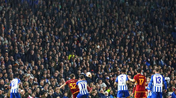 BRIGHTON, ENGLAND - MARCH 14: The Brighton crowd watches the match in heavy rain during the UEFA Europa League 2023/24 round of 16 second leg match between Brighton & Hove Albion and AS Roma at  on March 14, 2024 in Brighton, England.(Photo by Charlotte Wilson/Offside/Offside via Getty Images)