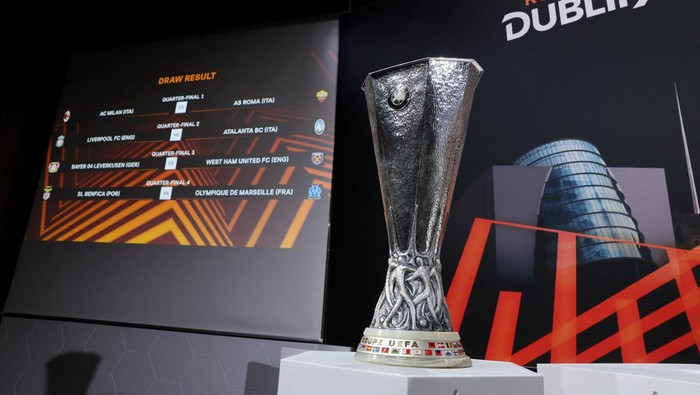 Soccer Football - Europa League - Draw For Quarter Final, Semi Final and Final - UEFA Headquarters, Nyon, Switzerland - March 15, 2024 General view of the Europa League trophy alongside the quarter final draw on the big screen REUTERS/Denis Balibouse
