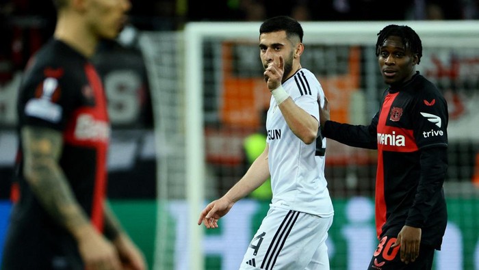 Soccer Football - Europa League - Round of 16 - Second Leg - Bayer Leverkusen v Qarabag - BayArena, Leverkusen, Germany - March 14, 2024 Qarabag's Elvin Cefarquliyev reacts after is shown a red card by referee Anthony Taylor as Bayer Leverkusen's Jeremie Frimpong looks on REUTERS/Wolfgang Rattay