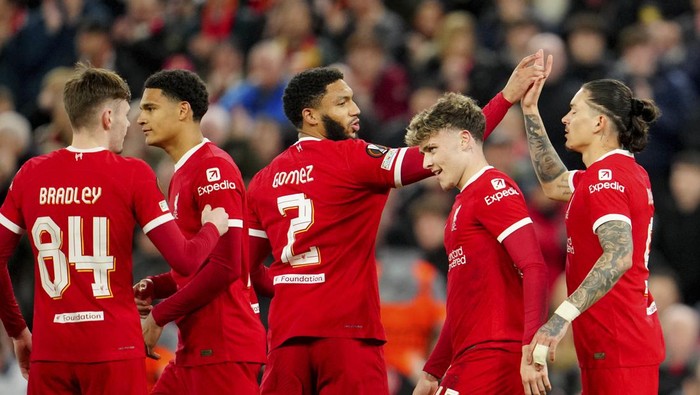 Liverpool players celebrate after Bobby Clark, 2nd right, scored their second goal during the Europa League round of 16, second leg, soccer match between Liverpool and Sparta Praha at Anfield Stadium, Liverpool, England, Thursday March 14, 2024. (AP Photo/Jon Super)