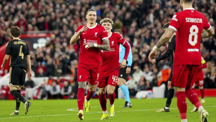 Liverpools Darwin Nunez, center, celebrates after scoring the opening goal during the Europa League round of 16, second leg, soccer match between Liverpool and Sparta Praha at Anfield Stadium, Liverpool, England, Thursday March 14, 2024. (AP Photo/Jon Super)