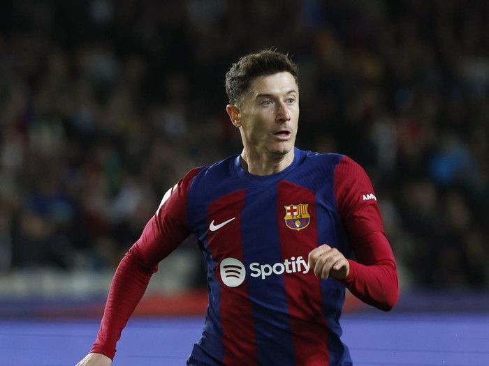 Barcelona's Robert Lewandowski runs during a Spanish La Liga soccer match between Barcelona and Mallorca at the Olimpic Lluis Companys stadium in Barcelona, Spain, Friday, March 8, 2024. (AP Photo/Joan Monfort)