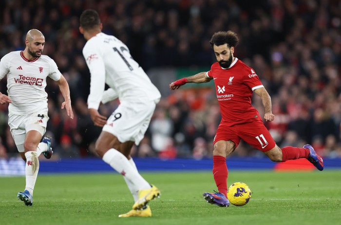 Mohamed Salah LIVERPOOL, ENGLAND - DECEMBER 17: Mohamed Salah of Liverpool on the ball during the Premier League match between Liverpool FC and Manchester United at Anfield on December 17, 2023 in Liverpool, England. (Photo by Clive Brunskill/Getty Images)