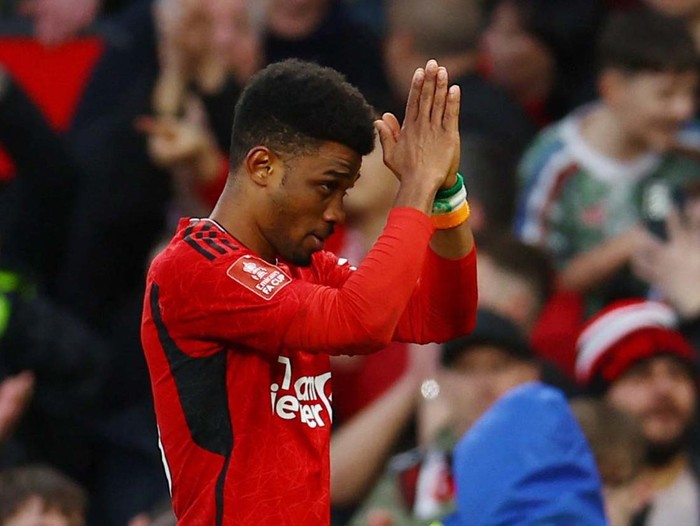 Soccer Football - FA Cup - Quarter Final - Manchester United v Liverpool - Old Trafford, Manchester, Britain - March 17, 2024
Manchester United's Amad Diallo celebrates scoring their fourth goal REUTERS/Molly Darlington