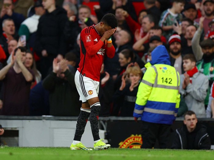 Soccer Football - FA Cup - Quarter Final - Manchester United v Liverpool - Old Trafford, Manchester, Britain - March 17, 2024
Manchester United's Amad Diallo celebrates scoring their fourth goal REUTERS/Molly Darlington