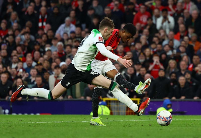 Soccer Football - FA Cup - Quarter Final - Manchester United v Liverpool - Old Trafford, Manchester, Britain - March 17, 2024Manchester United's Amad Diallo celebrates scoring their fourth goal REUTERS/Molly Darlington