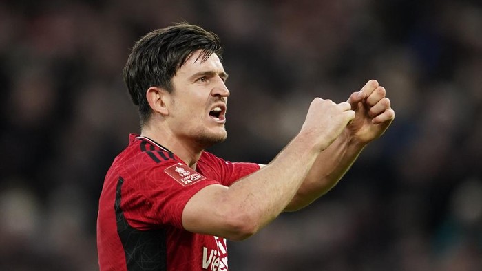Manchester Uniteds Harry Maguire celebrates at full time of the FA Cup quarterfinal soccer match between Manchester United and Liverpool at the Old Trafford stadium in Manchester, England, Sunday, March 17, 2024. Manchester United won 4-3. (AP Photo/Dave Thompson)