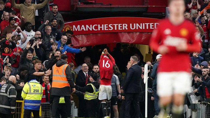 Manchester Uniteds Amad Diallo heads down the tunnel after being sent off for removing their shirt celebrating scoring their sides fourth goal of the game during the Emirates FA Cup quarter-final match at Old Trafford, Manchester. Picture date: Sunday March 17, 2024. (Photo by Martin Rickett/PA Images via Getty Images)