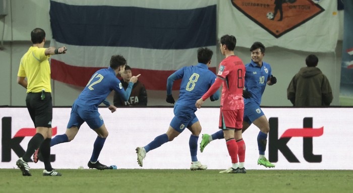 Suphanat Mueanta of Thailand, right, celebrates after scoring his sides first goal during the third round of the Asian qualifier group C match for 2026 FIFA World Cup between South Korea and Thailand at Seoul World Cup Stadium in Seoul, South Korea, Thursday, March 21, 2024. (Kim In-chul/Yonhap via AP)