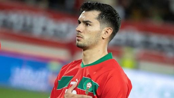 Moroccos midfielder #10 Brahim Diaz holds his hand on his heart before the international friendly football match between Morocco and Angola at Adrar Stadium in Agadir, Morocco, on March 22, 2024. (Photo by FADEL SENNA / AFP)