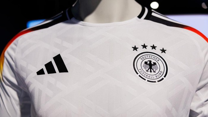 13 March 2024, Bavaria, Herzogenaurach: The official jerseys of the German national soccer team for the upcoming European Football Championship 2024 (UEFA EURO 2024) are on display at the headquarters of sporting goods manufacturer adidas AG. Photo: Daniel Karmann/dpa (Photo by Daniel Karmann/picture alliance via Getty Images)