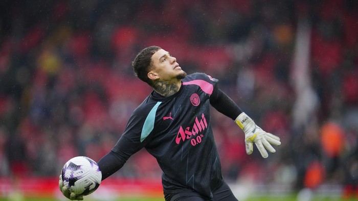 Manchester Citys goalkeeper Ederson throws the ball ahead of the English Premier League soccer match between Liverpool and Manchester City, at Anfield stadium in Liverpool, England, Sunday, March 10, 2024. (AP Photo/Jon Super)