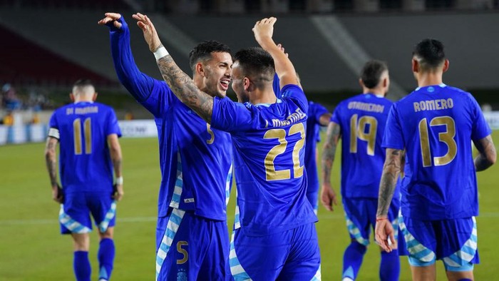 LOS ANGELES, CALIFORNIA - MARCH 26: Lautaro Martinez of Argentina celebrates with Leandro Paredes after scoring the third goal of his teamduring a friendly match between Argentina and Costa Rica at United Airlines Field at the Los Angeles Memorial Coliseum on March 26, 2024 in Los Angeles, California. (Photo by Gustavo Pagano/Getty Images)