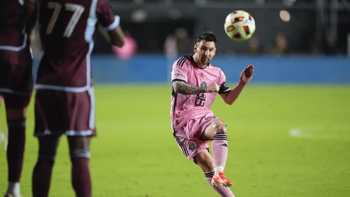 Inter Miami forward Lionel Messi, right, takes an unsuccessful free kick against the Colorado Rapids during the second half of an MLS soccer match, Saturday, April 6, 2024, in Fort Lauderdale, Fla. (AP Photo/Rebecca Blackwell)