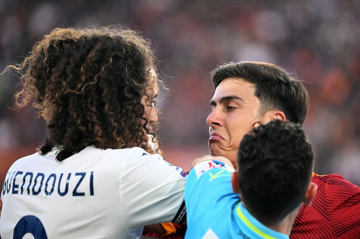 Soccer Football - Serie A - AS Roma v Lazio - Stadio Olimpico, Rome, Italy - April 6, 2024 
AS Roma's Paulo Dybala clashes with Lazio's Matteo Guendouzi REUTERS/Alberto Lingria