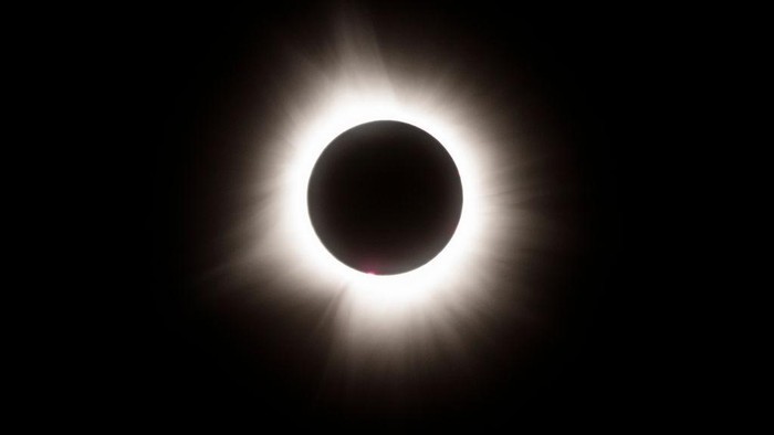 LAKE CARMI, VERMONT - APRIL 08: The moon crosses in front of the sun during the Great North American Solar Eclipse on April 08, 2024 in Lake Carmi, Vermont. Millions of people have flocked to areas across North America that are in the