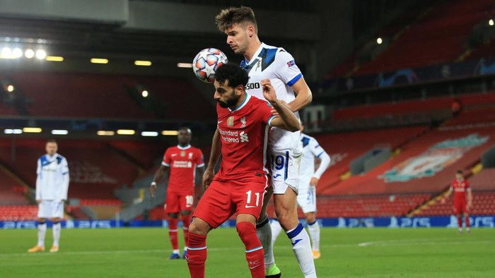 LIVERPOOL, ENGLAND - NOVEMBER 25: Mohamed Salah of Liverpool and Berat Djimsiti of Atalanta during the UEFA Champions League Group D stage match between Liverpool FC and Atalanta BC at Anfield on November 25, 2020 in Liverpool, United Kingdom. Sporting stadiums around the UK remain under strict restrictions due to the Coronavirus Pandemic as Government social distancing laws prohibit fans inside venues resulting in games being played behind closed doors. (Photo by Simon Stacpoole/Offside/Offside via Getty Images)