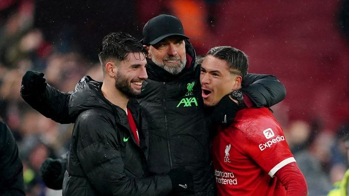 Liverpool manager Jurgen Klopp (centre) celebrates with Dominik Szoboszlai (left) and Darwin Nunez (right) after the Premier League match at Anfield, Liverpool. Picture date: Sunday December 3, 2023. (Photo by Peter Byrne/PA Images via Getty Images)