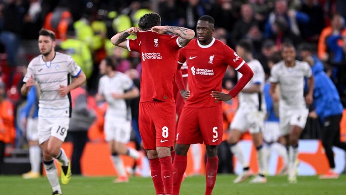 LIVERPOOL, ENGLAND - APRIL 11: Dominik Szoboszlai of Liverpool reacts after Mario Pasalic of Atalanta BC scores his teams third goal during the UEFA Europa League 2023/24 Quarter-Final first leg match between Liverpool FC and Atalanta at Anfield on April 11, 2024 in Liverpool, England. (Photo by Stu Forster/Getty Images)