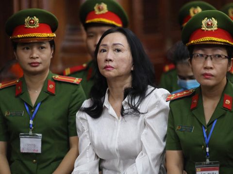 Vietnamese property tycoon Truong My Lan (C) looks on at a court in Ho Chi Minh city on April 11, 2024. A top Vietnamese property tycoon could face the death penalty when she and dozens of other co-accused face verdicts on April 11 in one of the country's biggest fraud cases over the embezzlement of USD 12.5 billion. (Photo by AFP)