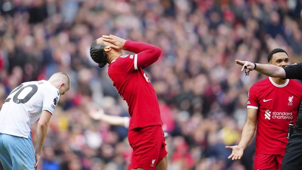 Liverpool's Virgil van Dijk reacts during the English Premier League soccer match between Liverpool and Crystal Palace at Anfield Stadium in Liverpool, England, Sunday, April 14, 2024. (AP Photo/Jon Super)