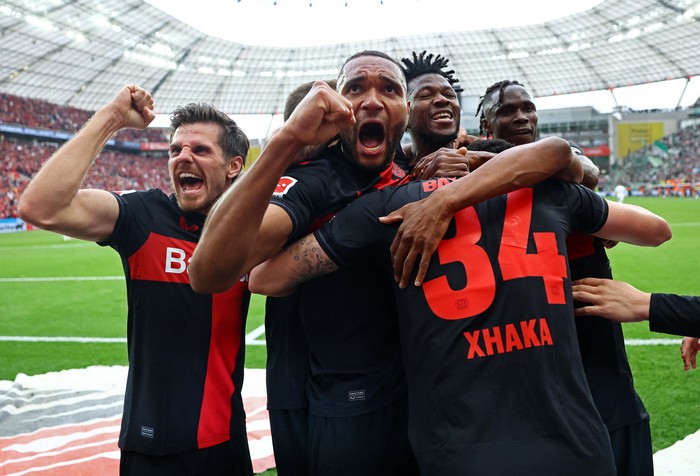 Soccer Football - Bundesliga - Bayer Leverkusen v Werder Bremen - BayArena, Leverkusen, Germany - April 14, 2024
Bayer Leverkusen fans celebrate in the stands REUTERS/Wolfgang Rattay DFL REGULATIONS PROHIBIT ANY USE OF PHOTOGRAPHS AS IMAGE SEQUENCES AND/OR QUASI-VIDEO.     TPX IMAGES OF THE DAY