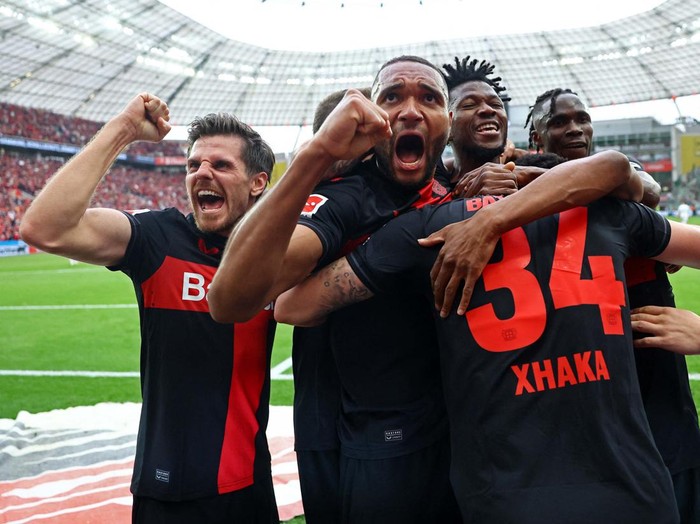 Soccer Football - Bundesliga - Bayer Leverkusen v Werder Bremen - BayArena, Leverkusen, Germany - April 14, 2024
Bayer Leverkusen fans celebrate in the stands REUTERS/Wolfgang Rattay DFL REGULATIONS PROHIBIT ANY USE OF PHOTOGRAPHS AS IMAGE SEQUENCES AND/OR QUASI-VIDEO.     TPX IMAGES OF THE DAY