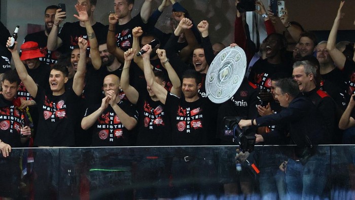 Soccer Football - Bundesliga - Bayer Leverkusen v Werder Bremen - BayArena, Leverkusen, Germany - April 14, 2024
Bayer Leverkusen fans celebrate in the stands REUTERS/Wolfgang Rattay DFL REGULATIONS PROHIBIT ANY USE OF PHOTOGRAPHS AS IMAGE SEQUENCES AND/OR QUASI-VIDEO.     TPX IMAGES OF THE DAY