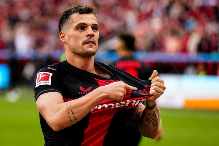 Granit Xhaka  Granit Xhaka of Bayer 04 Leverkusen celebrates after scoring his team's second goal during the Bundesliga match between Bayer 04 Leverkusen and SV Werder Bremen at BayArena on April 14, 2024 in Leverkusen, Germany.(Photo by Rene Nijhuis/MB Media/Getty Images)