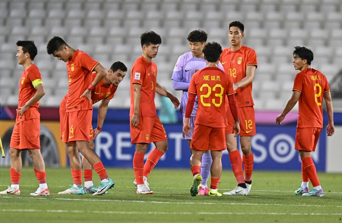 Players from China are reacting after the AFC U23 Asian Cup Qatar 2024 Group B match between Japan and China at Jassim Bin Hamad Stadium in Doha, Qatar, on April 16, 2024. (Photo by Noushad Thekkayil/NurPhoto via Getty Images)