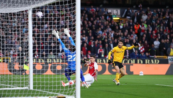 WOLVERHAMPTON, ENGLAND - APRIL 20:  Joao Gomes of Wolverhampton Wanderers hits the post as his side look for an opener during the Premier League match between Wolverhampton Wanderers and Arsenal FC at Molineux on April 20, 2024 in Wolverhampton, England.(Photo by Copa/Getty Images)