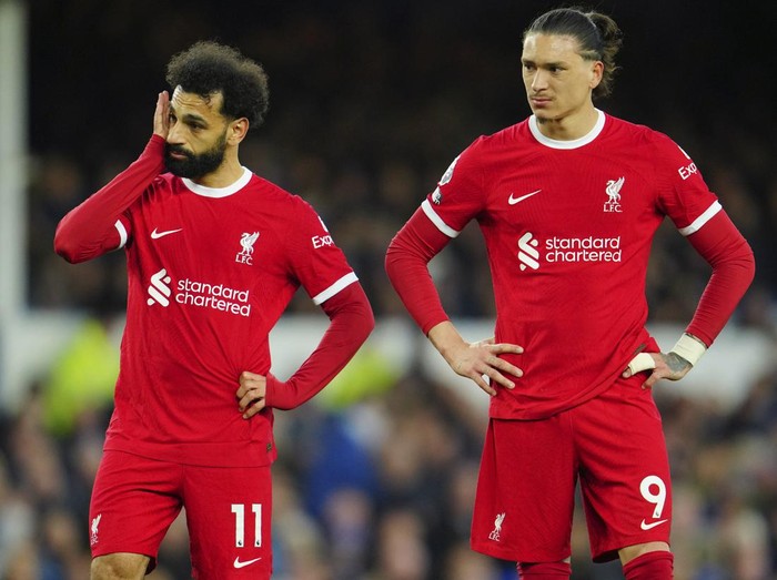 Liverpool's Mohamed Salah, left, and Liverpool's Darwin Nunez react during the English Premier League soccer match between Everton and Liverpool at the Goodison Park stadium in Liverpool, Britain, Wednesday, April 24, 2024. (AP Photo/Jon Super)