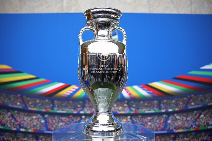 Soccer Football - Euro 2024 - Trophy Display at Olympiastadion - Olympiastadion, Berlin, Germany - April 24, 2024 Euro 2024 mascot Albart poses with the European Championship trophy REUTERS/Liesa Johannssen