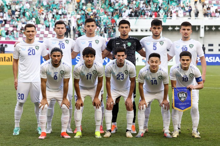 DOHA, QATAR - APRIL 26: Players of Uzbekistan line up for team photo during the AFC U23 Asian Cup Quarter Final match between Uzbekistan and Saudi Arabia at Khalifa International Stadium on April 26, 2024 in Doha, Qatar.  (Photo by Zhizhao Wu/Getty Images)
