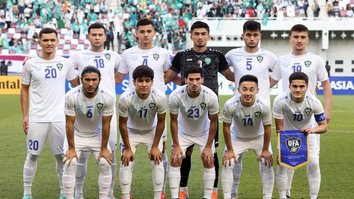 DOHA, QATAR - APRIL 26: Players of Uzbekistan line up for team photo during the AFC U23 Asian Cup Quarter Final match between Uzbekistan and Saudi Arabia at Khalifa International Stadium on April 26, 2024 in Doha, Qatar.  (Photo by Zhizhao Wu/Getty Images)