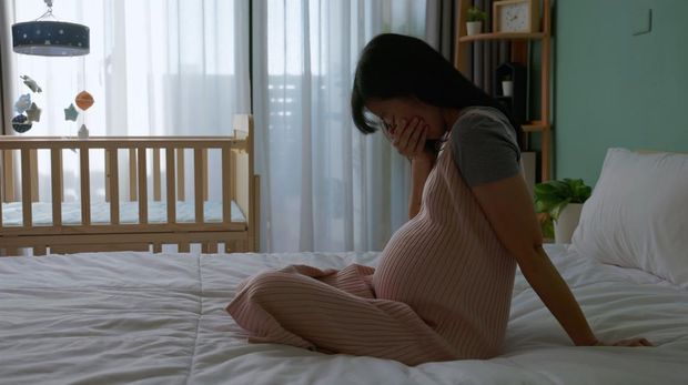 silhouette asian pregnant woman feel depressed about being new mother