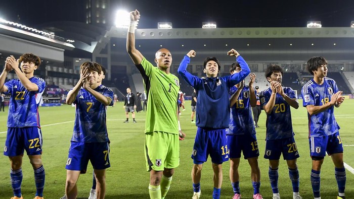 Players from Japan are celebrating their victory following the AFC U23 Asian Cup Qatar 2024 quarter-final match between Qatar and Japan at Jassim Bin Hamad Stadium in Doha, Qatar, on April 25, 2024. (Photo by Noushad Thekkayil/NurPhoto via Getty Images)