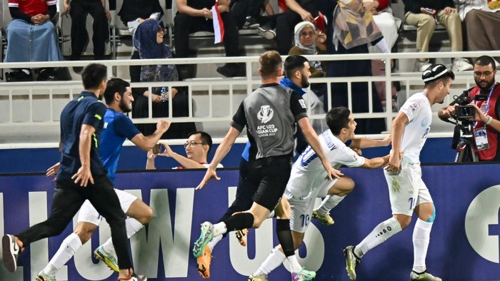 Husain Norchaev (R) of Uzbekistan  is celebrating after scoring a goal during the AFC U23 Asian Cup Qatar 2024 Semi Final match between Indonesia and Uzbekistan at Abdullah Bin Khalifa Stadium in Doha, Qatar, on April 29, 2024. 



 (Photo by Noushad Thekkayil/NurPhoto via Getty Images)