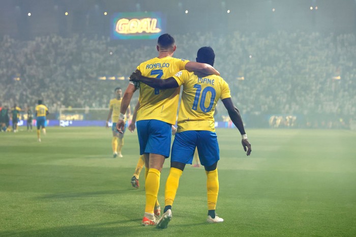 RIYADH, SAUDI ARABIA - SEPTEMBER 22: Cristiano Ronaldo of Al-Nassr Club celebrates with :Sadio Mane of Al Nassr Club after scoring his teams first goal during the Saudi Pro League match between Al- Nassr and Al-Ahli at King Saud University Stadium on September 22, 2023 in Riyadh, Saudi Arabia. (Photo by Francois Nel/Getty Images)